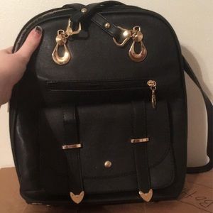 Black Leather Backpack with Gold Accents